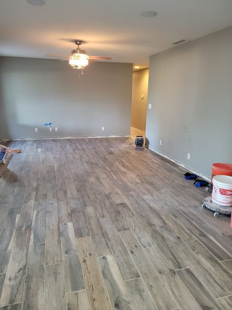 Wood-look plank tile floor installed across a large room in Riverside, California